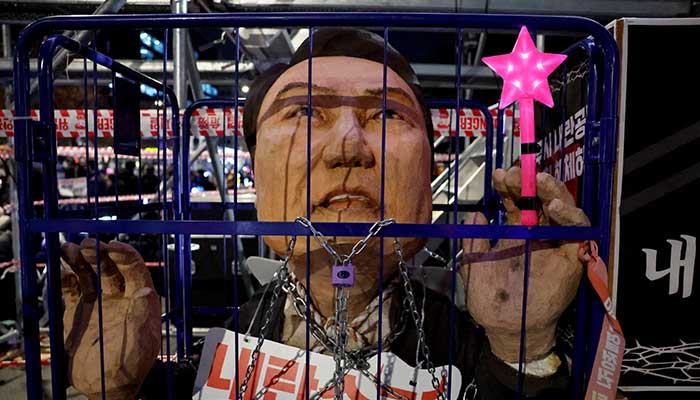 An effigy depicting South Korean President Yoon Suk Yeol stands in a cage as protesters take part in a rally calling for the impeachment of South Korean President, who declared martial law, which was reversed hours later, in front of the National Assembly in Seoul, South Korea, December 13, 2024. — Reuters