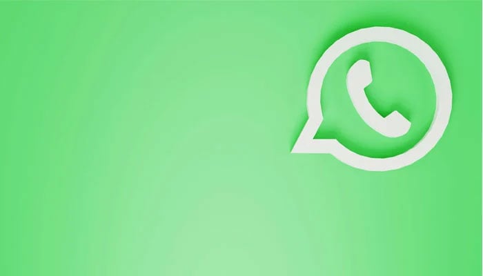 A representational image shows the WhatsApp logo displayed against a green background. — Unsplash