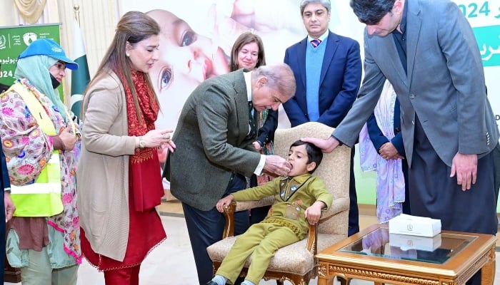 Prime Minister Shehbaz Sharif administers polio drops to a child during the launching ceremony of the last anti-polio campaign of 2024 in Islamabad on December 15, 2024. —PPI