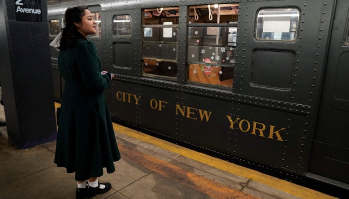 A woman waits to ride the Holiday Nostalgia Train in New York on December 8, 2024. — AFP