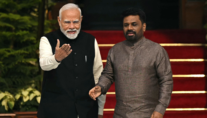 India´s Prime Minister Narendra Modi (L) and Sri Lanka´s President Anura Kumara Dissanayake shake hands before their meeting at the Hyderabad House in New Delhi on December 16, 2024. — AFP