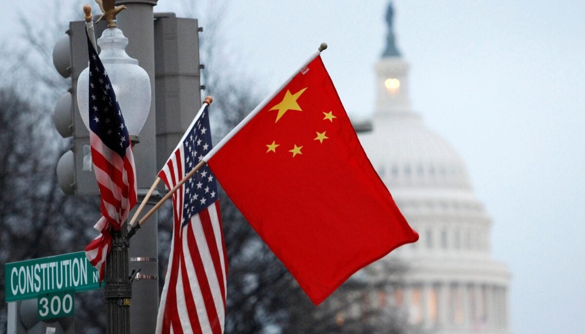 The Peoples Republic of China flag and the US flag fly on a lamp post along Pennsylvania Avenue near the US Capitol in Washington during then-Chinese President Hu Jintaos state visit, January 18, 2011. — Reuters