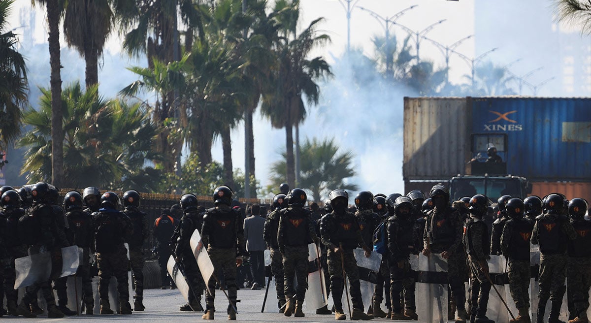 Security force personnel guard a road to prevent an anti-government rally by supporters of the PTI in Islamabad, November 26, 2024. — Reuters