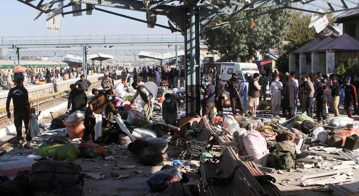 Police personnel and people gather at the site amid the debris after a bomb blast at a railway station in Quetta November 9, 2024. — Reuters