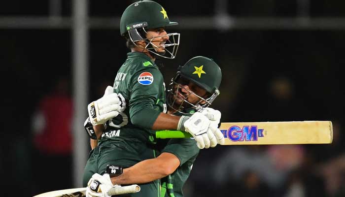 Pakistans Saim Ayub (left) and Salman Ali Agha celebrate during the first ODI against South Africa at The Boland Oval in Paarl on December 17, 2024. — AFP