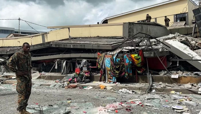 A member of security inspects a collapsed building in Vanuatu´s capital Port Vila after a powerful earthquake hit the Pacific island on December 17, 2024. — AFP