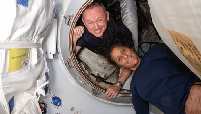 Butch Wilmore (upper left) and Sunita Williams pictured inside the vestibule between the forward port on the International Space Stations Harmony module and Boeings Starliner spacecraft. — AFP/file