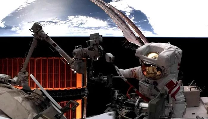 This screengrab shows Shenzhou 19 astronaut Cai Xuzhe conducts a spacewalk outside Chinas Tiangong space station on December 17, 2024. — CMSEO