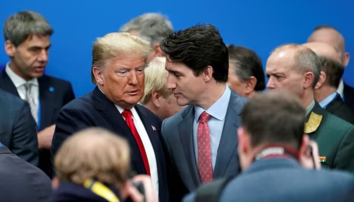 US President Donald Trump talks with Canadas Prime Minister Justin Trudeau during a NATO Plenary Session in Watford, near London on December 4, 2019. —Reuters