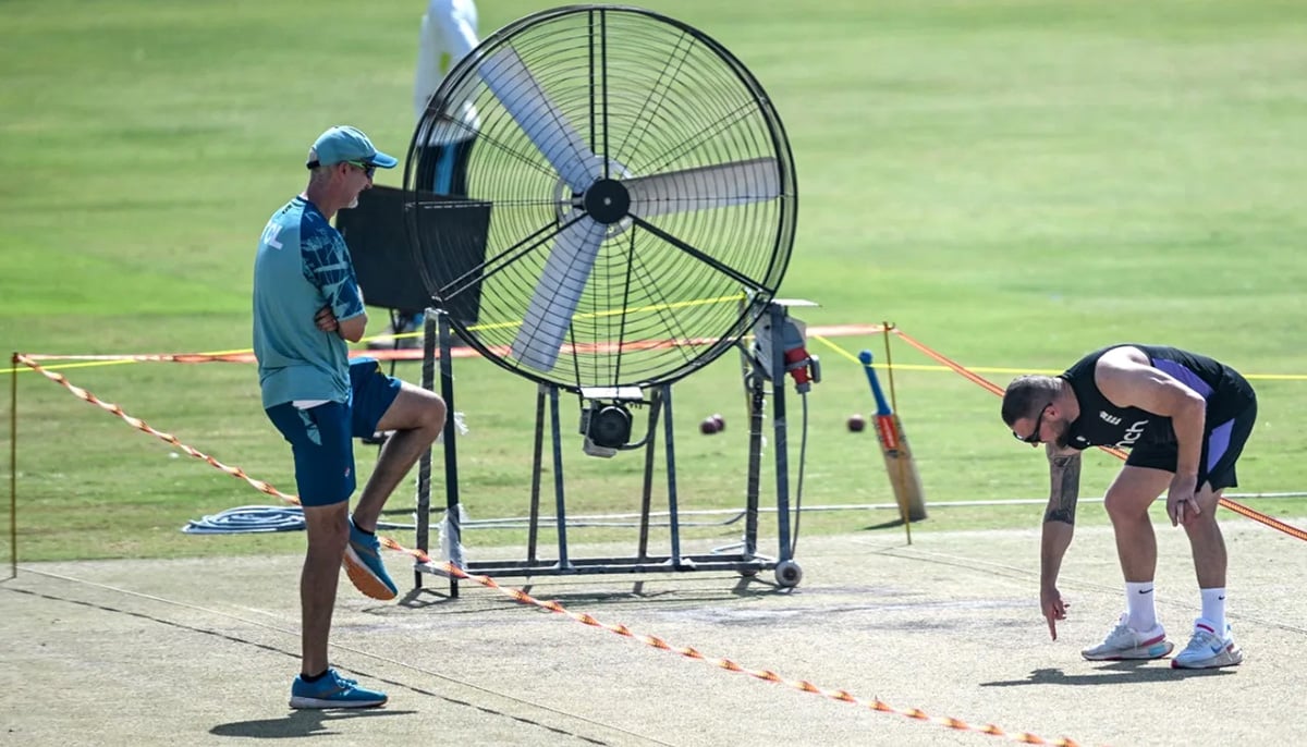 Englands head coach Brendon McCullum (R) with his Pakistani counterpart Jason Gillespie (2R) inspects the pitch during a practice session ahead of their second Test cricket match at the Multan Cricket Stadium in Multan on October 13, 2024. — AFP