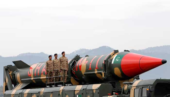 Pakistani military personnel stand beside a Shaheen III surface-to-surface ballistic missile during Pakistan Day military parade in Islamabad, Pakistan March 23, 2019. — Reuters