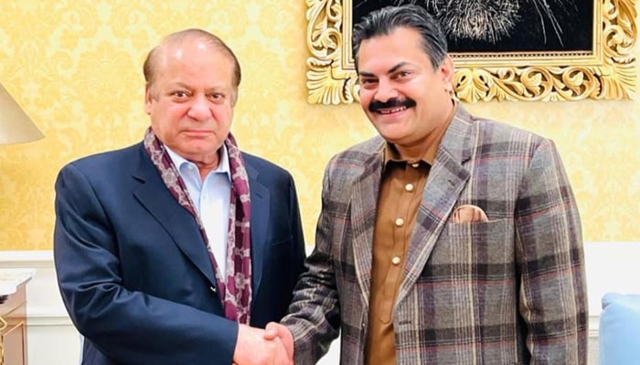 Mian Saleem Raza (right), the central character of Judge Arshad Malik video scandal, poses for an image with PML-N President Nawaz Sharif. — Reporter