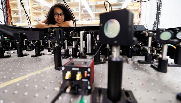 Experimental physicist Daniela Angulo poses with an apparatus in the physics lab at the University of Toronto. — AFP/File