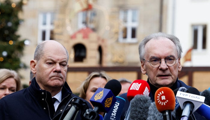 German Chancellor Olaf Scholz looks on as Prime Minister of Saxony-Anhalt Reiner Haseloff speaks to the media during a visit to the site where a car drove into a crowd of a Christmas market in Magdeburg, Germany December 21, 2024. — Reuters