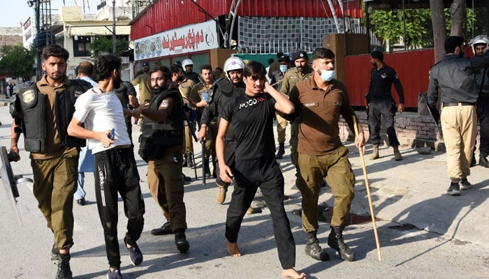 Punjab police personnel arrest PTI supporters and activists during a protest in Rawalpindi on September 28, 2024. — Online