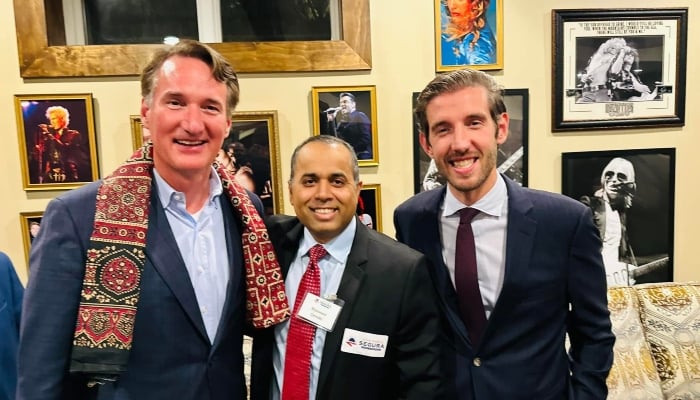 Mansoor Qureshi (centre) and Virginia Republican Governor Glenn Youngkin (left). — Reporter