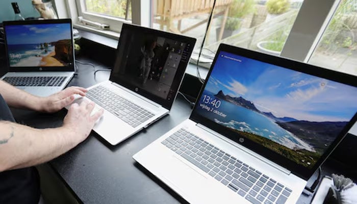 A representational image of a man working on his laptops. — Reuters