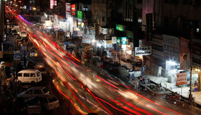 A road crowded with cars seen amid a bustling market place in Karachi is seen in this undated image. — Reuters/File