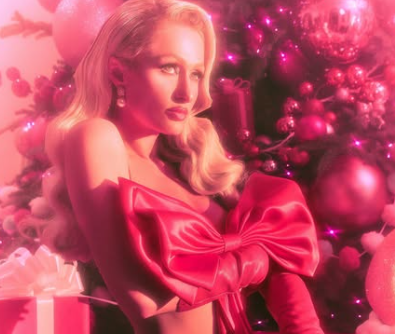 Paris Hilton surprises fans with red bow on Christmas