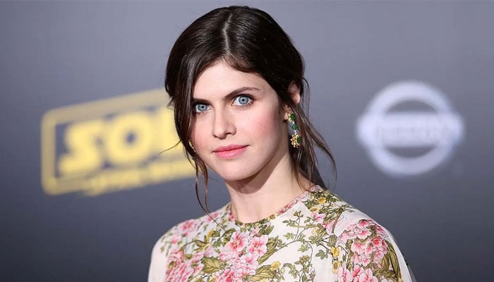 Alexandra Daddario tries out Christmas-inspired outifts on her baby