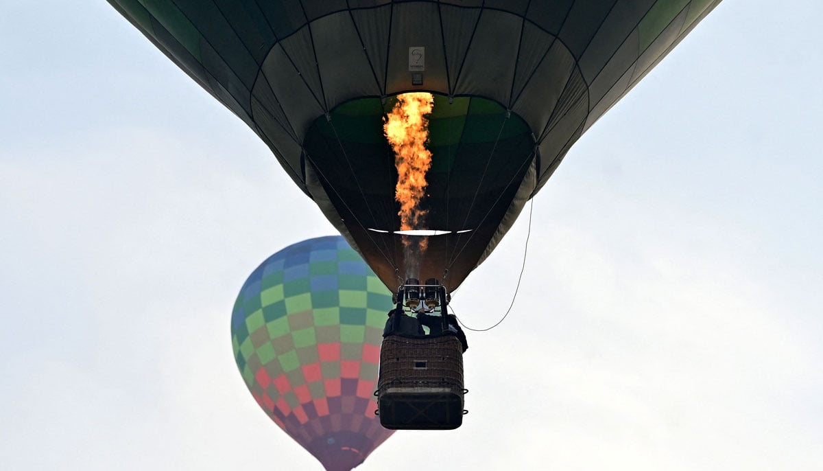 Hot air balloons rise in sky during the international festival at Pokhara in Nepal on December 25, 2024. — AFP