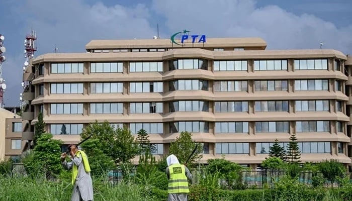 People work near the Pakistan Telecommunication Authority (PTA) headquarters building in Islamabad on August 16, 2024. — AFP