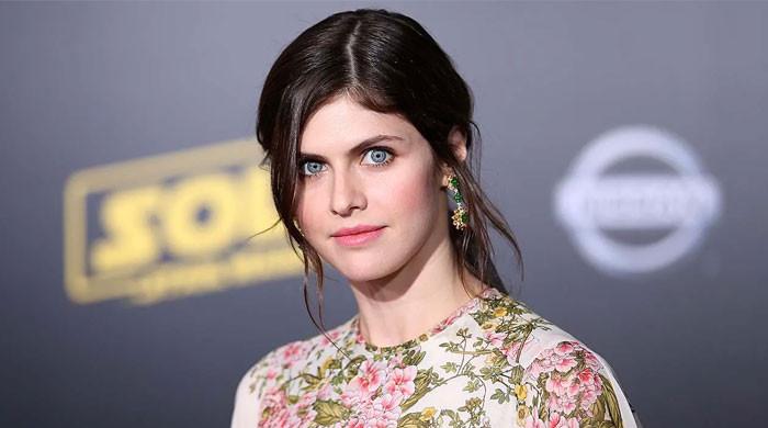 Alexandra Daddario tries out Christmas-inspired outifts on her baby