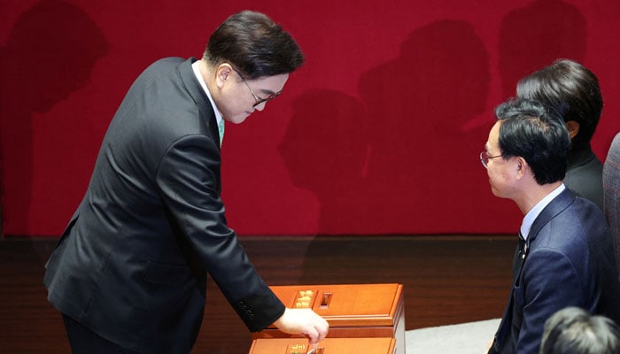 National Assembly Speaker Woo Won-shik casts his ballot for the impeachment motion of South Korean acting President and Prime Minister Han Duck-soo during a plenary session at the National Assembly in Seoul, South Korea, December 27, 2024. — Reuters