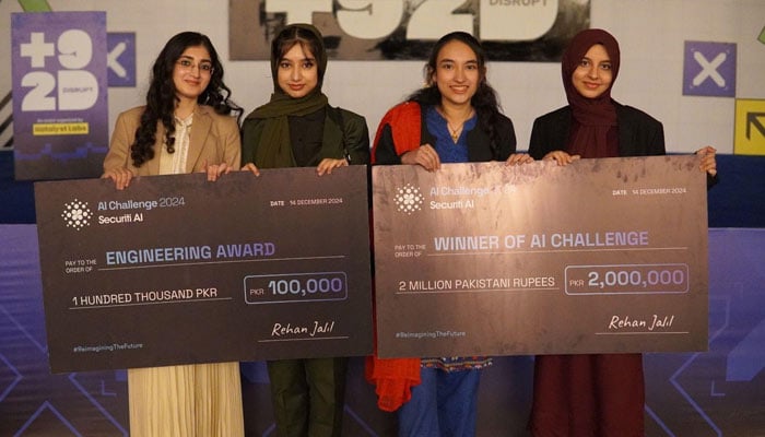 Winners of the AI Challenge (right) and Engineering Award seen in this picture from the event. — Image provided by Katalyst Labs