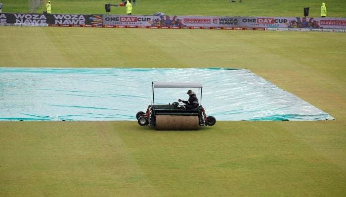 A groundsman drives a Super Sopper on the outfield next to the covered pitch as rain delays the start of play on the third day of the first cricket Test match between South Africa and Pakistan at SuperSport Park in Centurion on December 28, 2024. —AFP