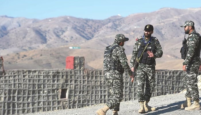 Pakistani soldiers stand guard near the Afghan border in Ghulam Khan, a village in KPs North Waziristan. — AFP/File