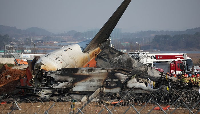 Rescue workers take part in a salvage operation at the site where an aircraft crashed after it went off the runway at Muan International Airport, in Muan, South Korea on December 29, 2024. — Reuters