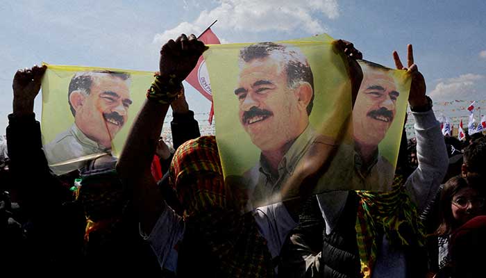 Supporters of the pro-Kurdish Peoples Equality and Democracy Party (DEM Party) display flags with a portrait of jailed Kurdistan Workers Party (PKK) leader Abdullah Ocalan, in Istanbul, Turkiye, March 17, 2024. — Reuters