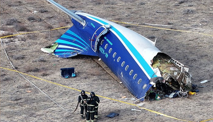 A drone view shows emergency specialists working at the crash site of an Azerbaijan Airlines passenger plane near the city of Aktau, Kazakhstan December 25, 2024. — Reuters