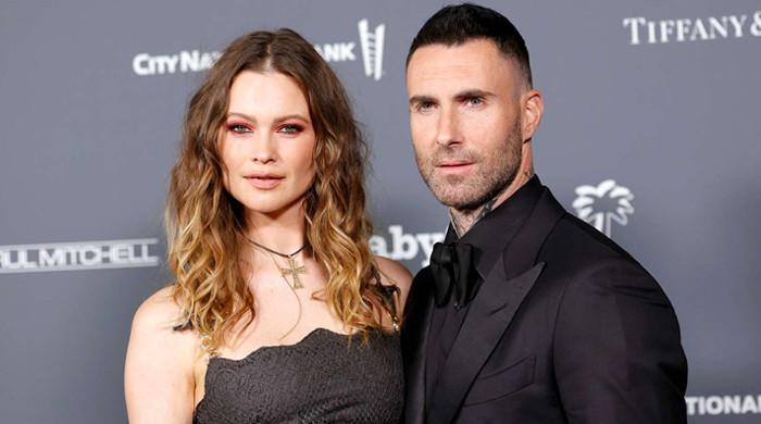 Behati Prinsloo shows loved up display with husband Adam Levine