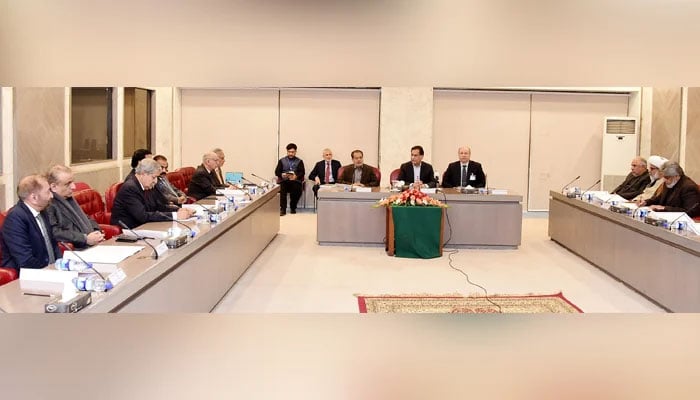 Members of the government and PTIs negotiation committees meet under the chairmanship of NA Speaker Ayaz Sadiq on December 23, 2024, at the Parliament House in Islamabad. — PID