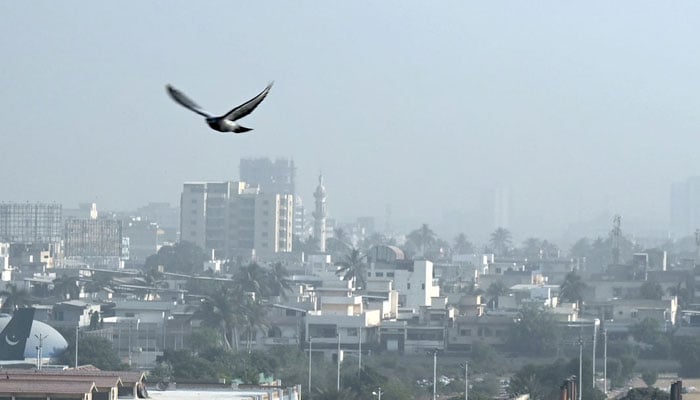 A view of foggy weather on during winter season in Karachi on December 5, 2024. — AFP