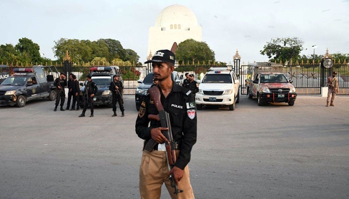 A policeman stands guard outside Mazar-e-Quaid in Karachi on May 9, 2024. — Online