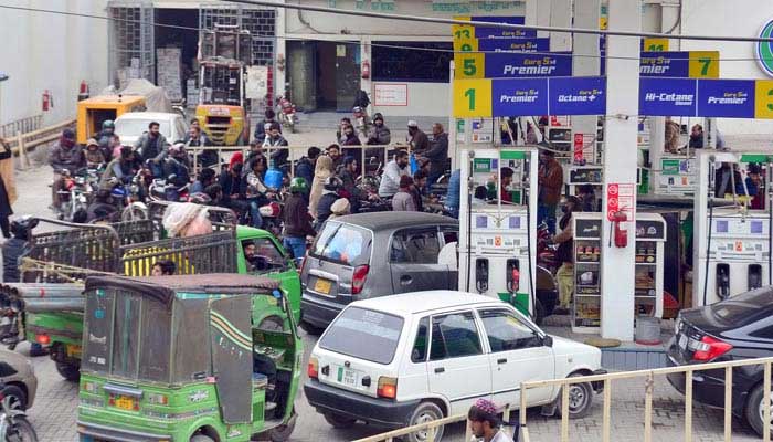 A view of people standing in a queue for filling petrol outside a petrol pump in Rawalpindi on January 29, 2023. — Online