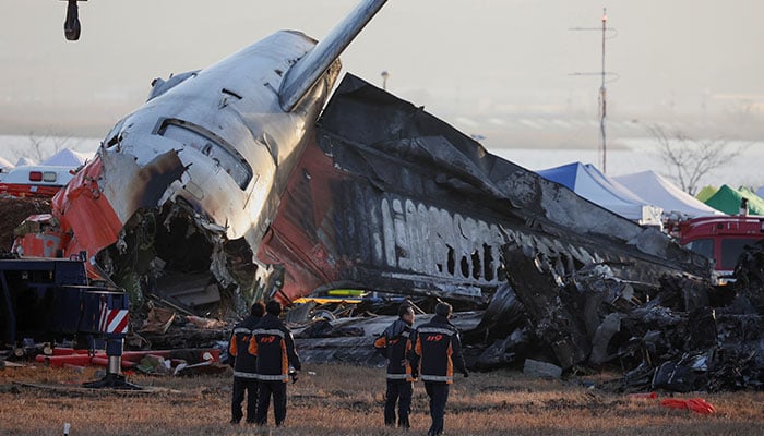 Firefighters take a look at the wreckage of the aircraft that crashed after it went off the runway, at Muan International Airport, in Muan, South Korea, December 31, 2024. — Reuters