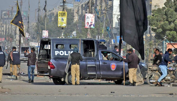 Police personnel remove a camp MWM protesters during sit-in against Parachinar killings at Karachis Abbas Town on December 31, 2024. — Online