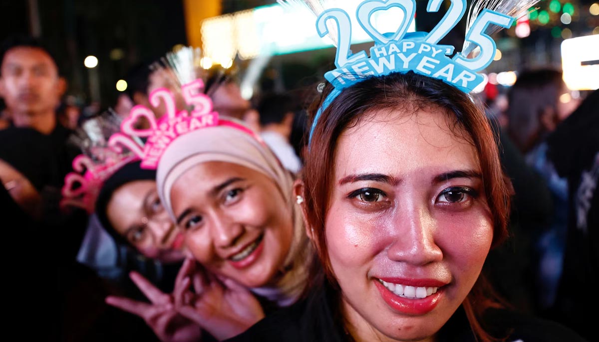 Women wearing 2025 headbands attend New Years Eve celebrations in Jakarta, Indonesia, December 31. — Reuters