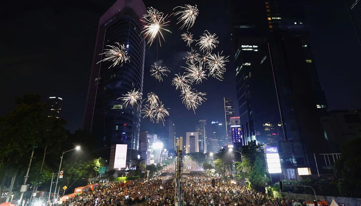 People attend New Years Eve celebrations in Jakarta, Indonesia, December 31. — Reuters