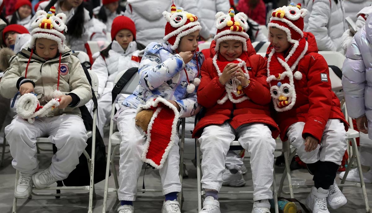 Child performers wait backstage before a countdown celebration event on New Years Eve, at Shougang Park in Beijing, China, December 31. — Reuters