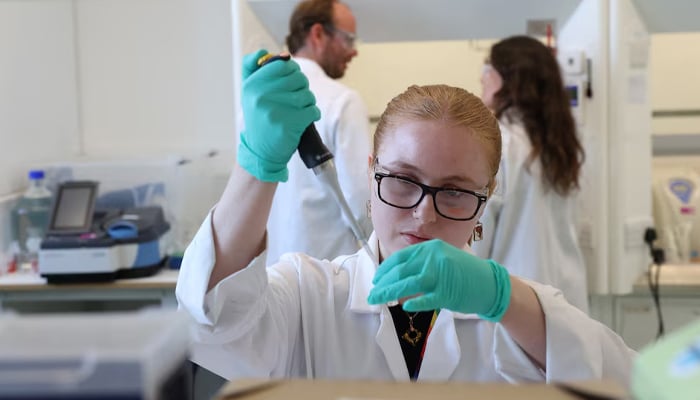 A representational image of chemist Zoe Sheaf working at biotechnology research company HydRegen, based at University of Oxford Begbroke Science Park, in Kidlington near Oxford, Britain, June 16, 2023. — Reuters