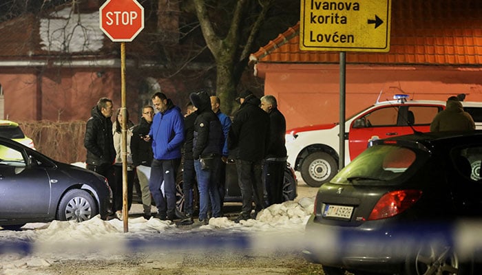 Police and security personnel stand near the scene where a gunman opened fire at a restaurant and killed several people in Cetinje, Montenegro, January 1, 2025. — Reuters