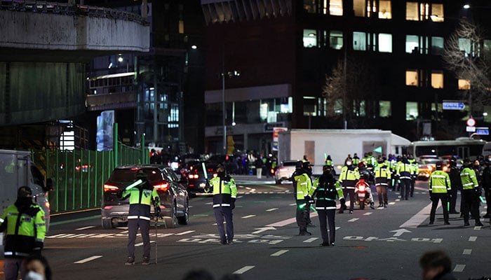 Police officers control the traffic in front of the impeached South Korean President Yoon Suk Yeols official residence, as Yoon faces potential arrest after a court on Tuesday approved a warrant for his arrest, in Seoul, South Korea, January 3, 2025. — Reuters