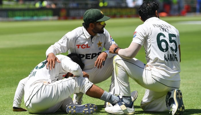 Saim Ayub (left) reacts in pain after being injured on January 3, 2025. —AFP