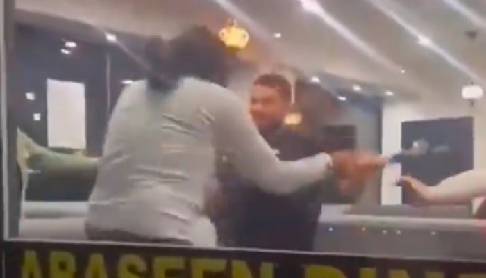 Indian national can be seen attacking restaurant worker in this screengrab, in Sheffield, England. X/@Partisan_12