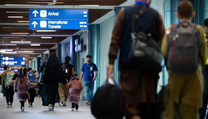 This handout photo taken on January 6, 2025 and received from the US embassy in Manila shows Afghans, whose US Special Immigrant Visa will be processed, arriving at an airport terminal on the Philippines Luzon island. — AFP